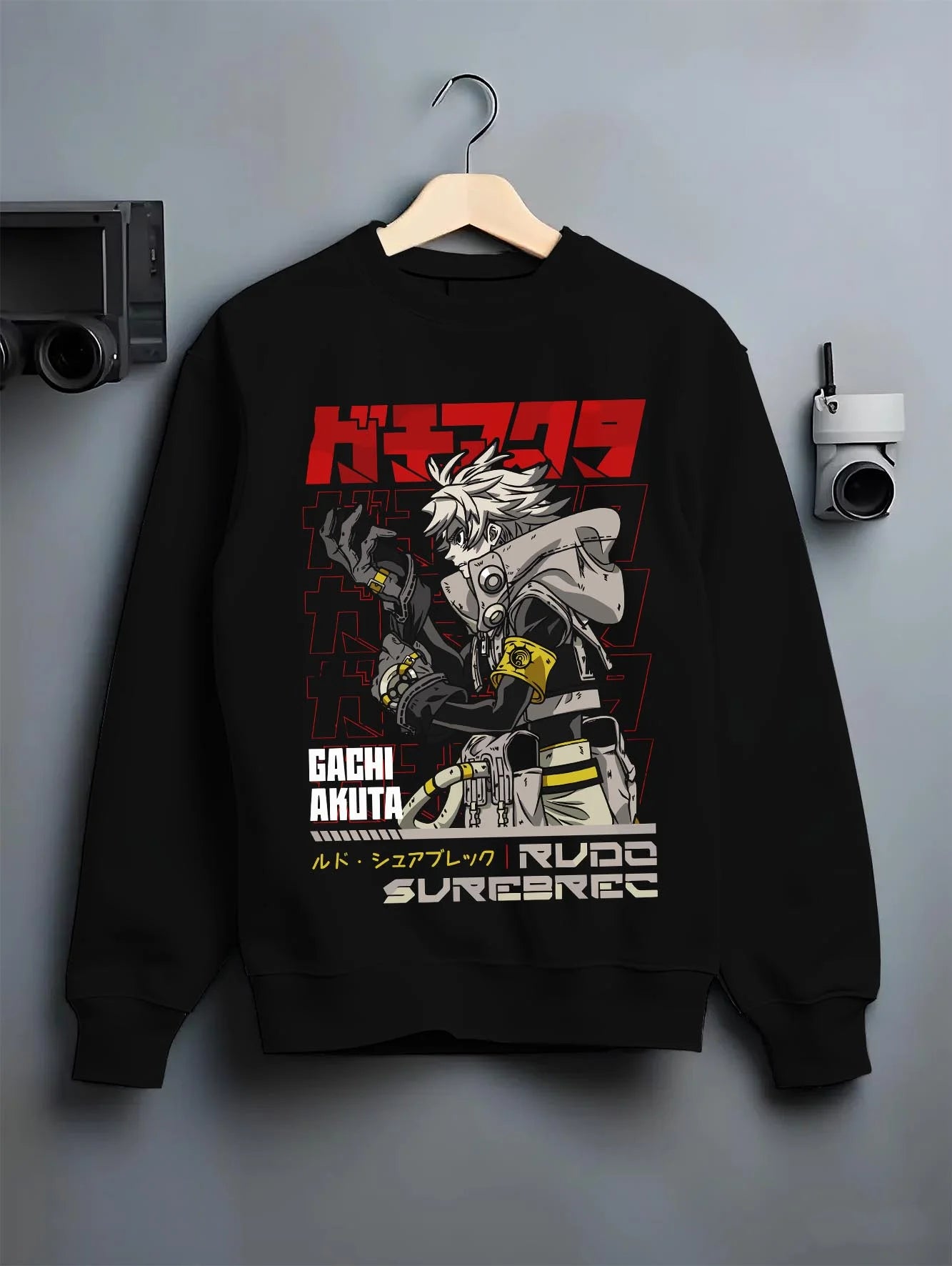 Black crewneck sweatshirt on hanger with Rudo Hoodie Gachiakuta Weaponized Armor Suit graphic Rudo themed artwork.