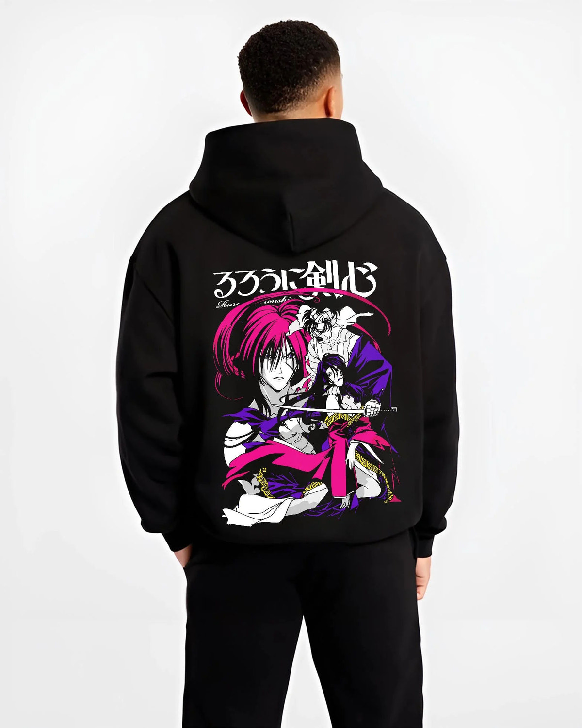 Black hoodie worn by male model from the back featuring Kenshin Himura reverse blade sword Rurouni Kenshin artwork.