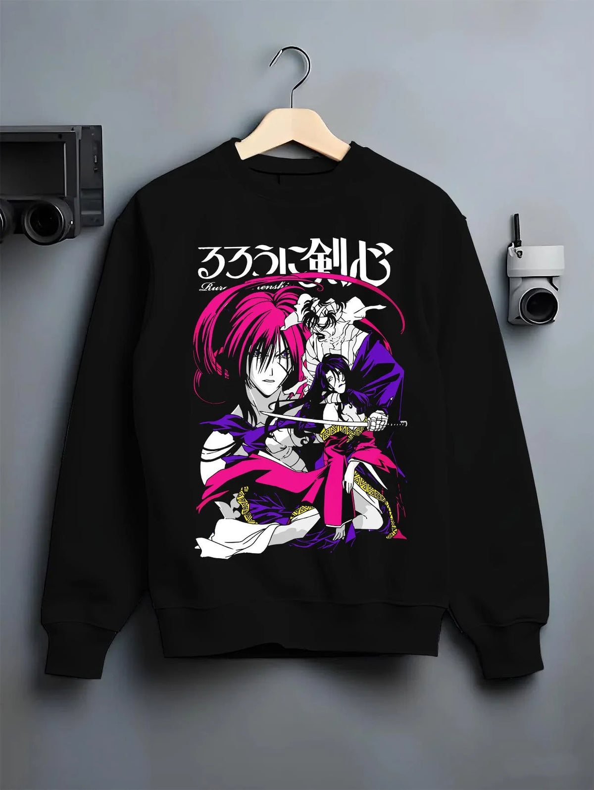 Black crewneck sweatshirt on hanger featuring Kenshin Himura reverse blade sword Rurouni Kenshin artwork.