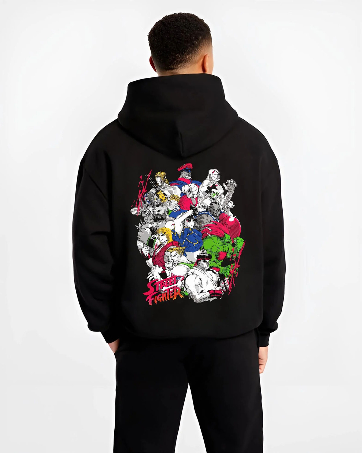 Black hoodie worn by male model from the back featuring Ryu Hadouken World Warrior Street Fighter artwork.