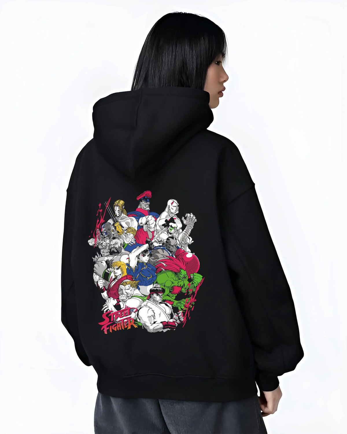 Black hoodie worn by female model from the back featuring Ryu Hadouken World Warrior Street Fighter artwork.