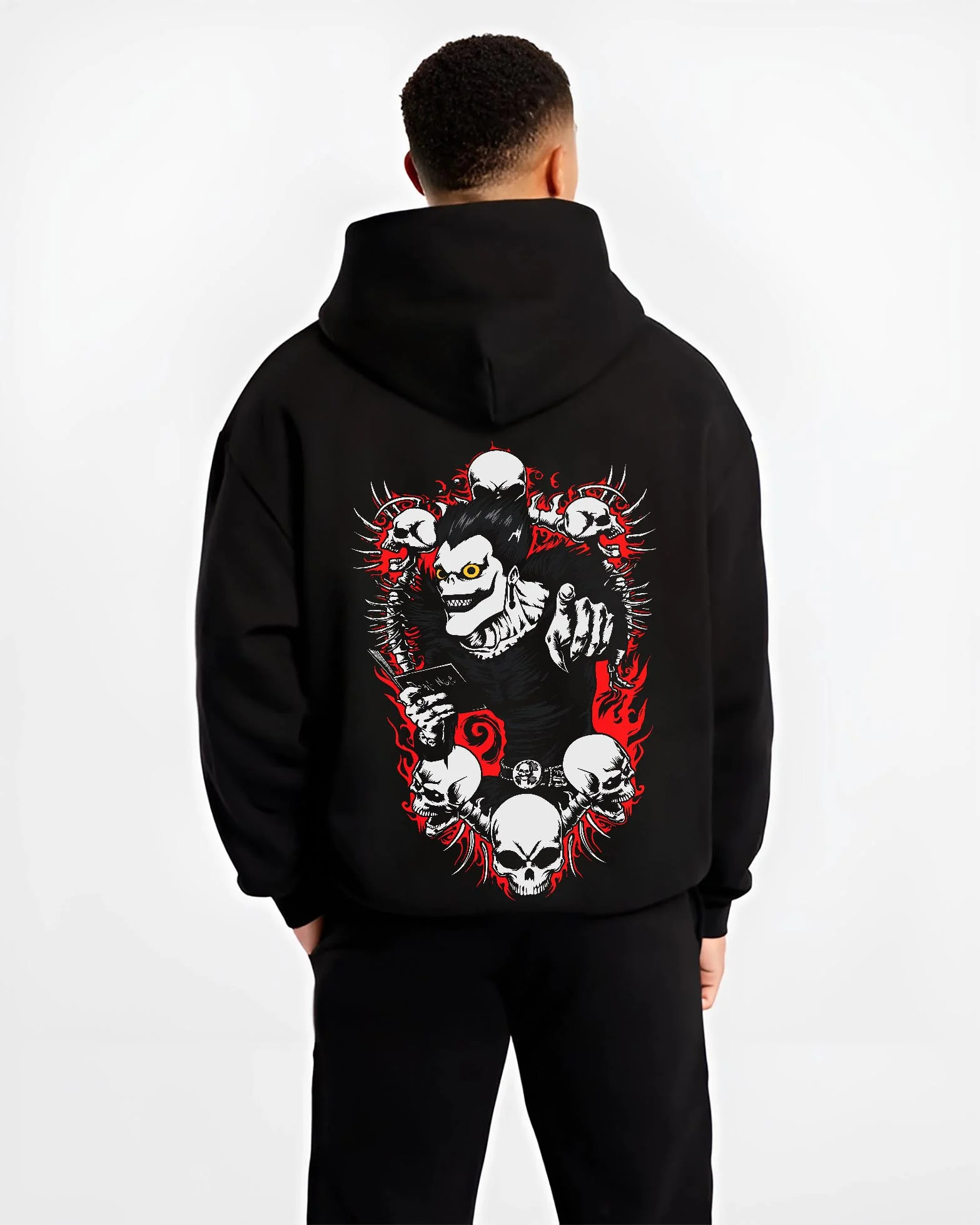Black hoodie worn by male model, back view with Ryuk Hoodie Death Note Shinigami Apple Reaper Anime graphic Ryuk themed artwork.