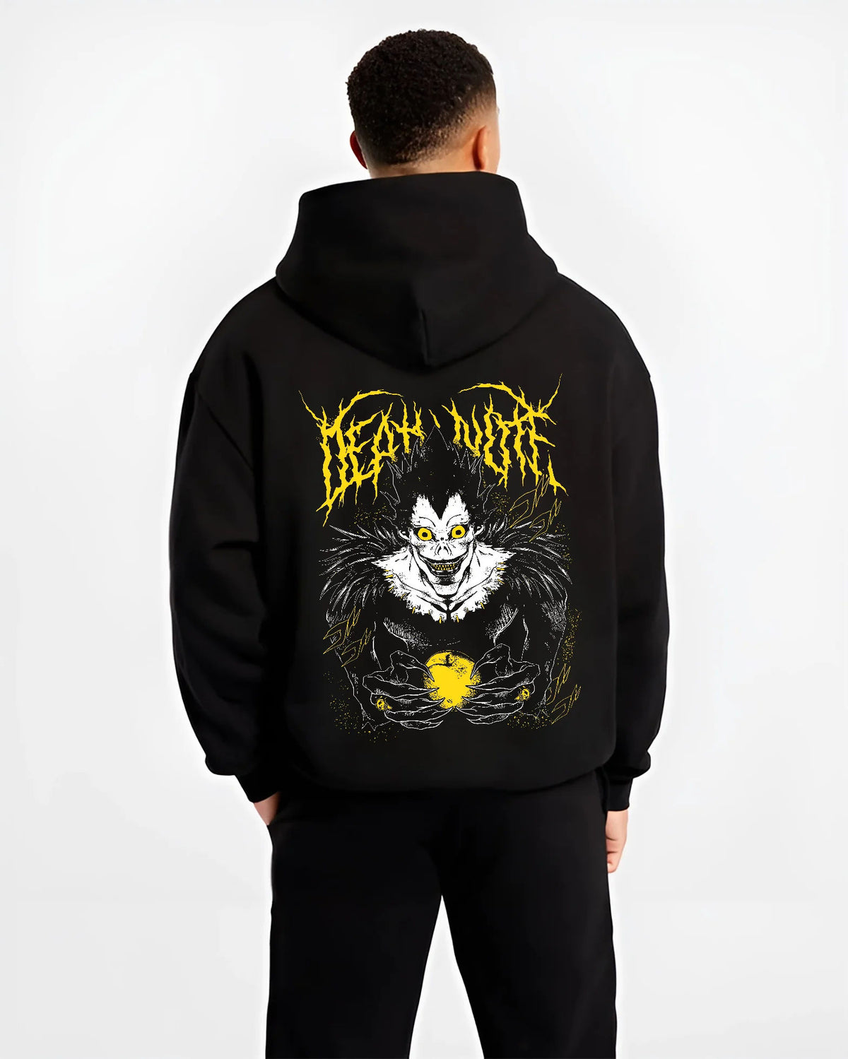 Black hoodie model back view showing Ryuk from Death Note: Shinigami with apple