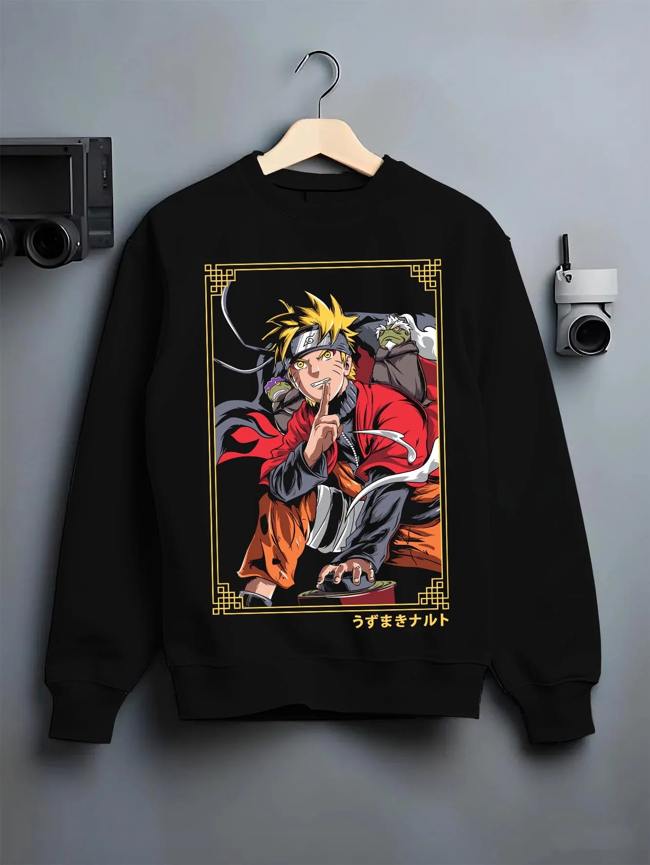 Black crewneck sweatshirt on hanger with Naruto Uzumaki Hoodie Naruto Shippuden Sage Pose graphic streetwear graphic.