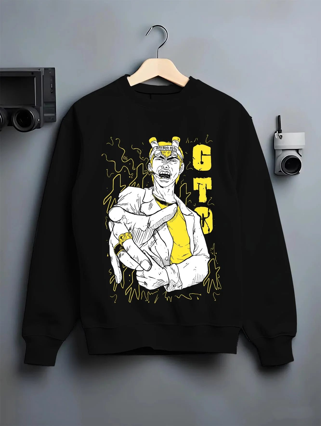 Black crewneck sweatshirt on hanger with Eikichi Onizuka Hoodie Great Teacher Onizuka GTO graphic streetwear graphic.