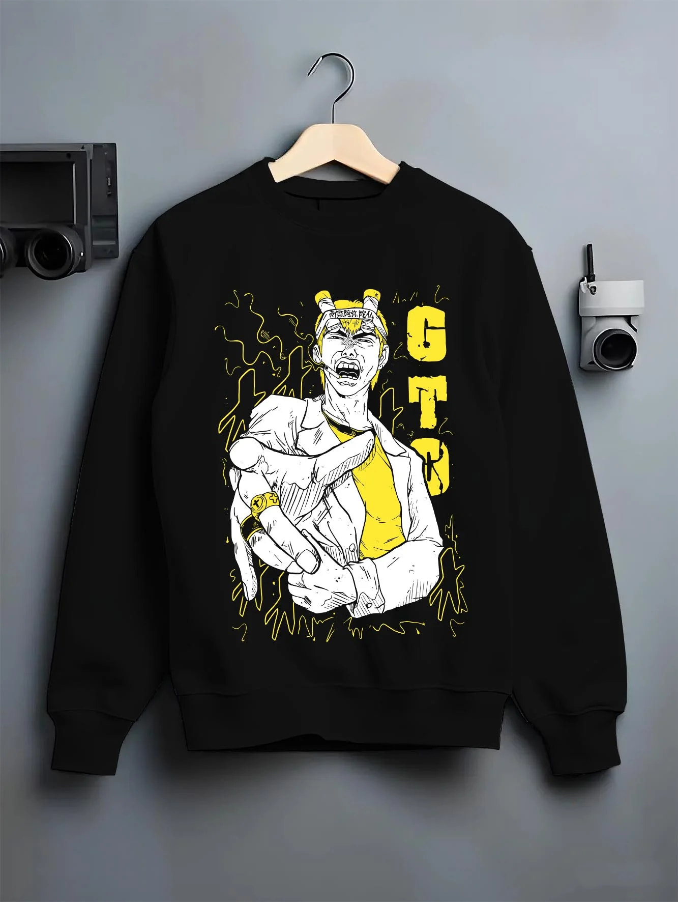Black crewneck sweatshirt on hanger with Eikichi Onizuka Hoodie Great Teacher Onizuka GTO graphic streetwear graphic.
