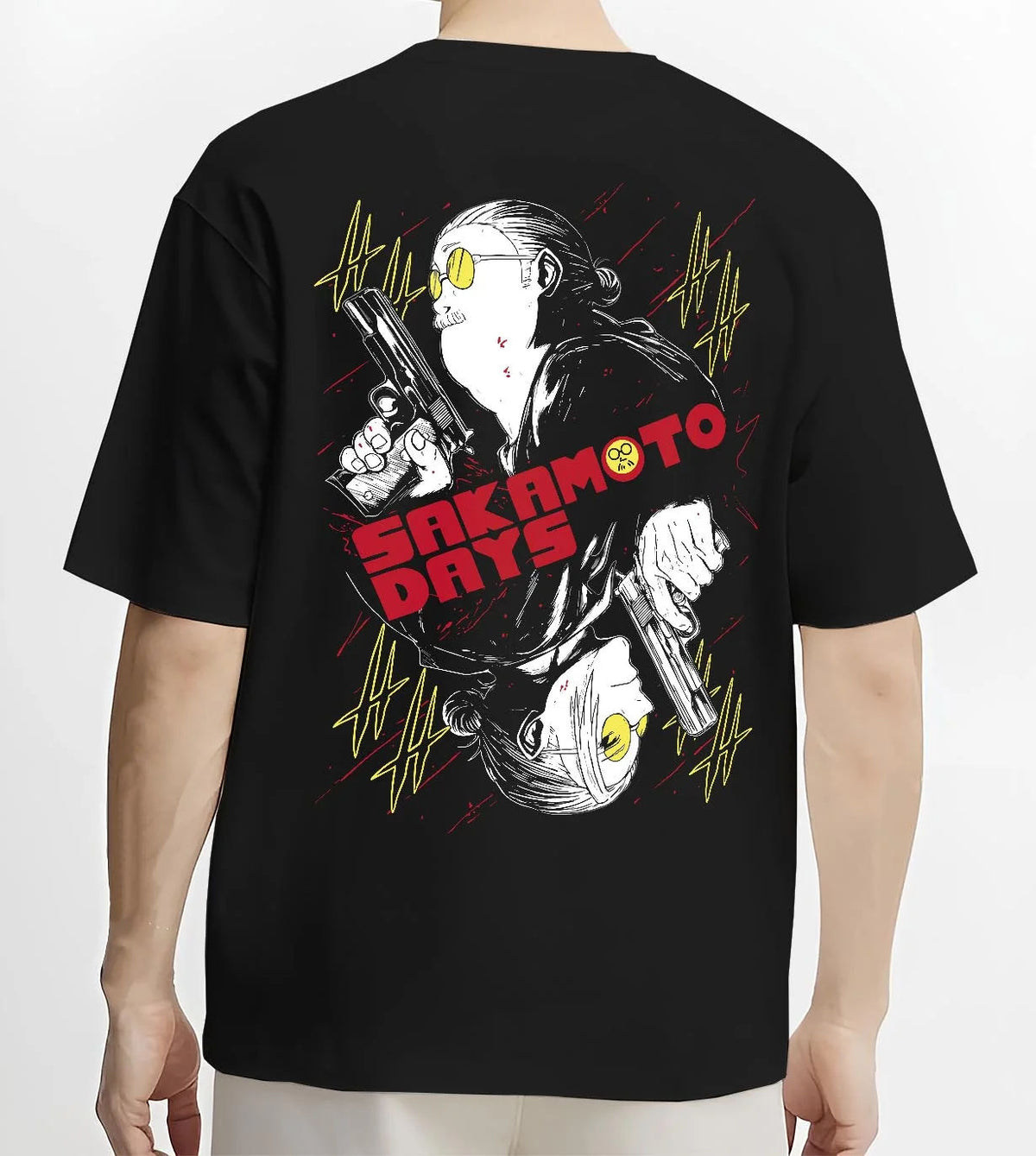 Black T-shirt worn by male model from the back featuring Sakamoto Days assassin duo pistol battle artwork.