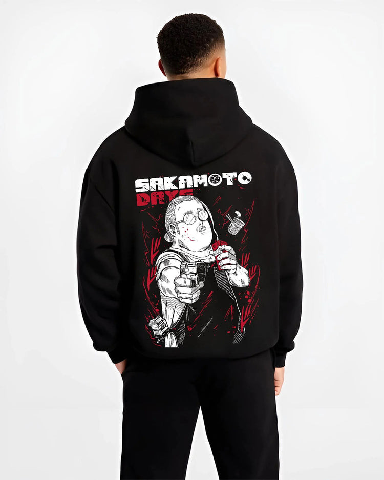 Black hoodie worn by male model from the back featuring Taro Sakamoto assassin street style Sakamoto Days artwork.
