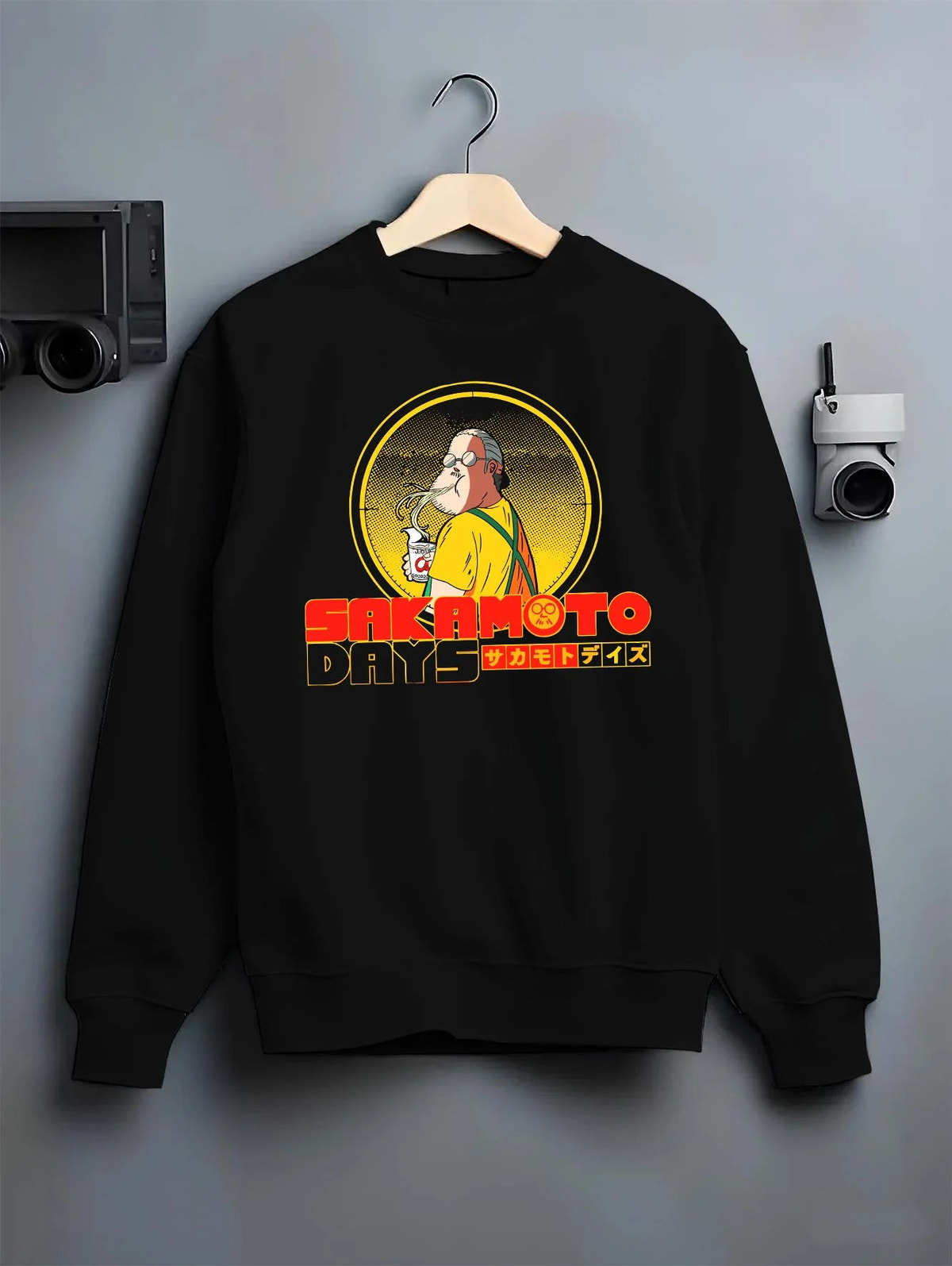Black crewneck sweatshirt on hanger featuring Sakamoto Days veteran assassin artwork.