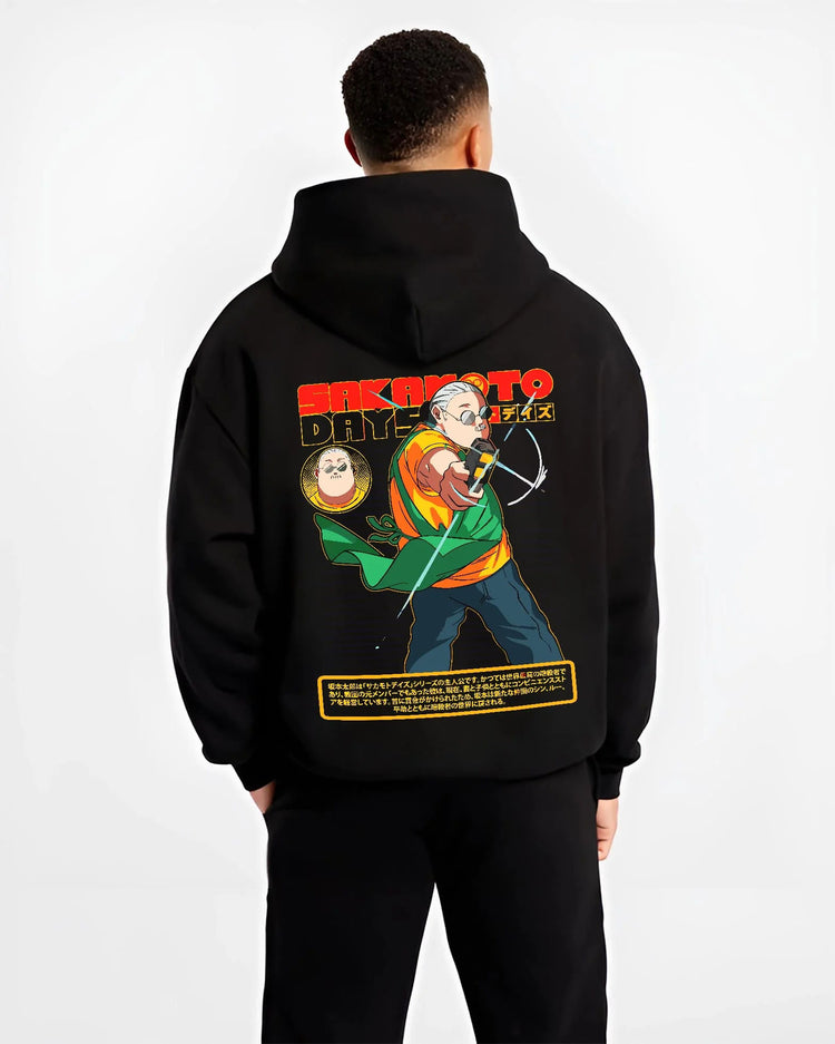 Black hoodie worn by male model from the back featuring Taro Sakamoto assassin battle Sakamoto Days artwork.