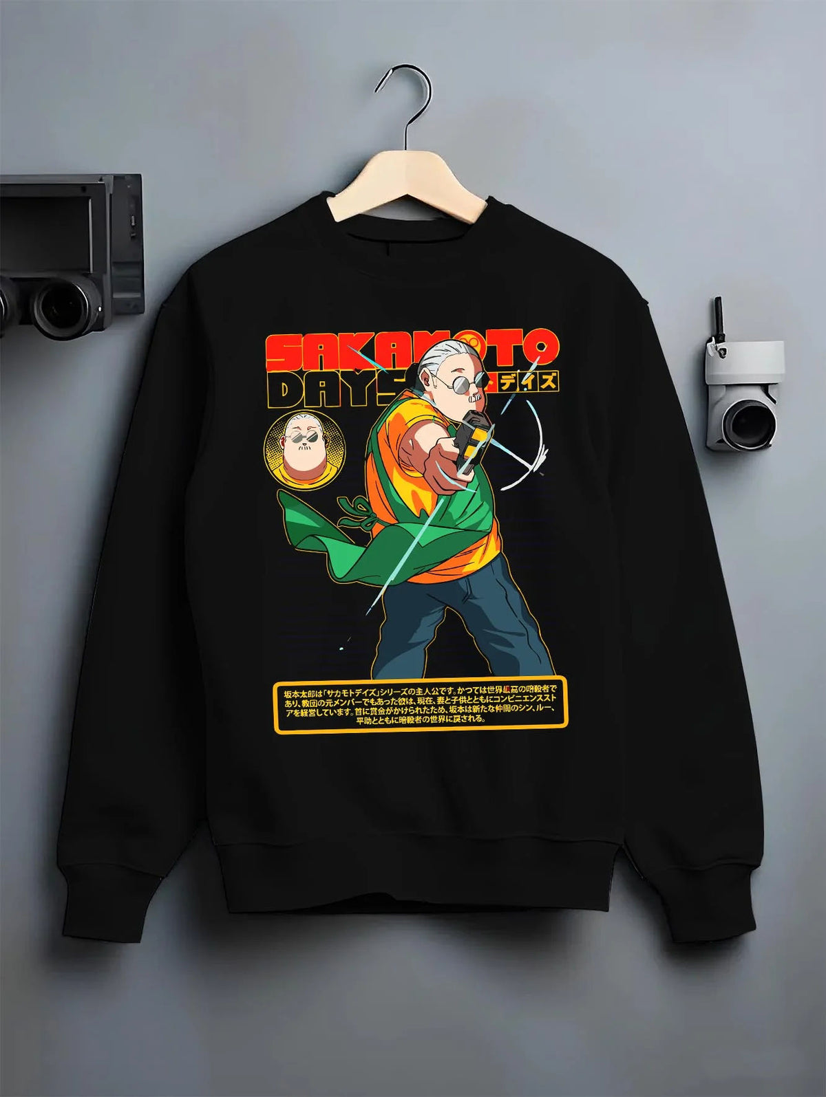 Black crewneck sweatshirt on hanger featuring Taro Sakamoto assassin battle Sakamoto Days artwork.