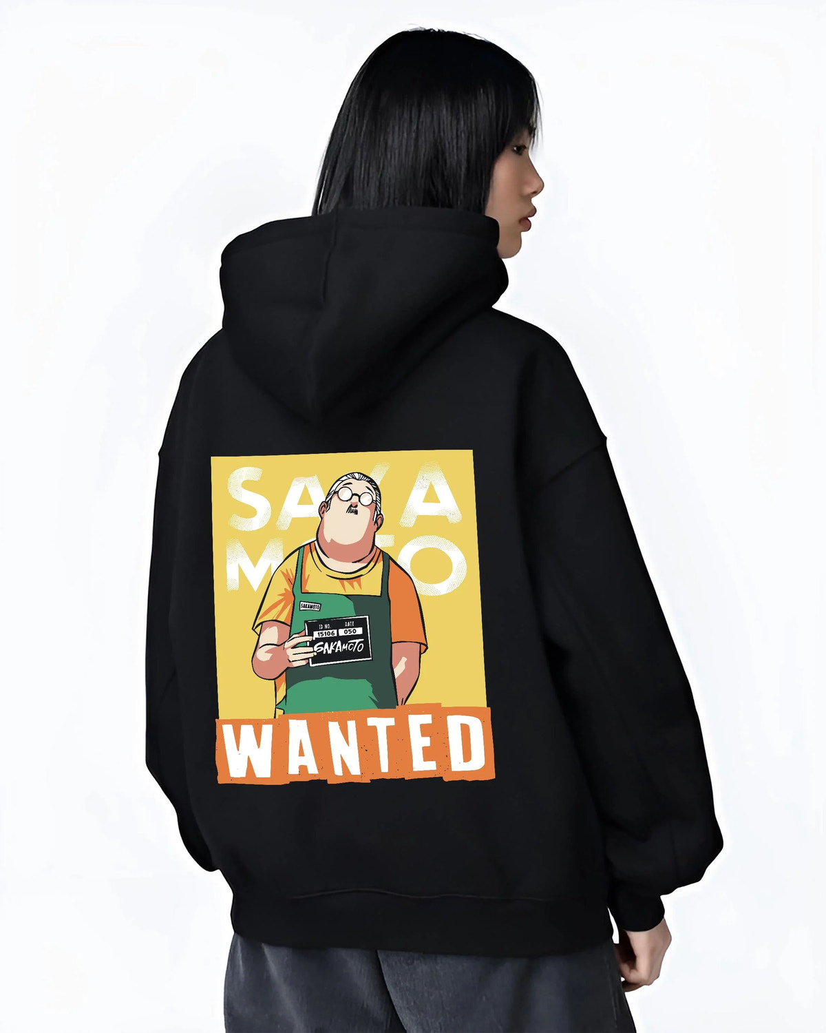 Black hoodie worn by female model from the back featuring Taro Sakamoto wanted poster Sakamoto Days artwork.