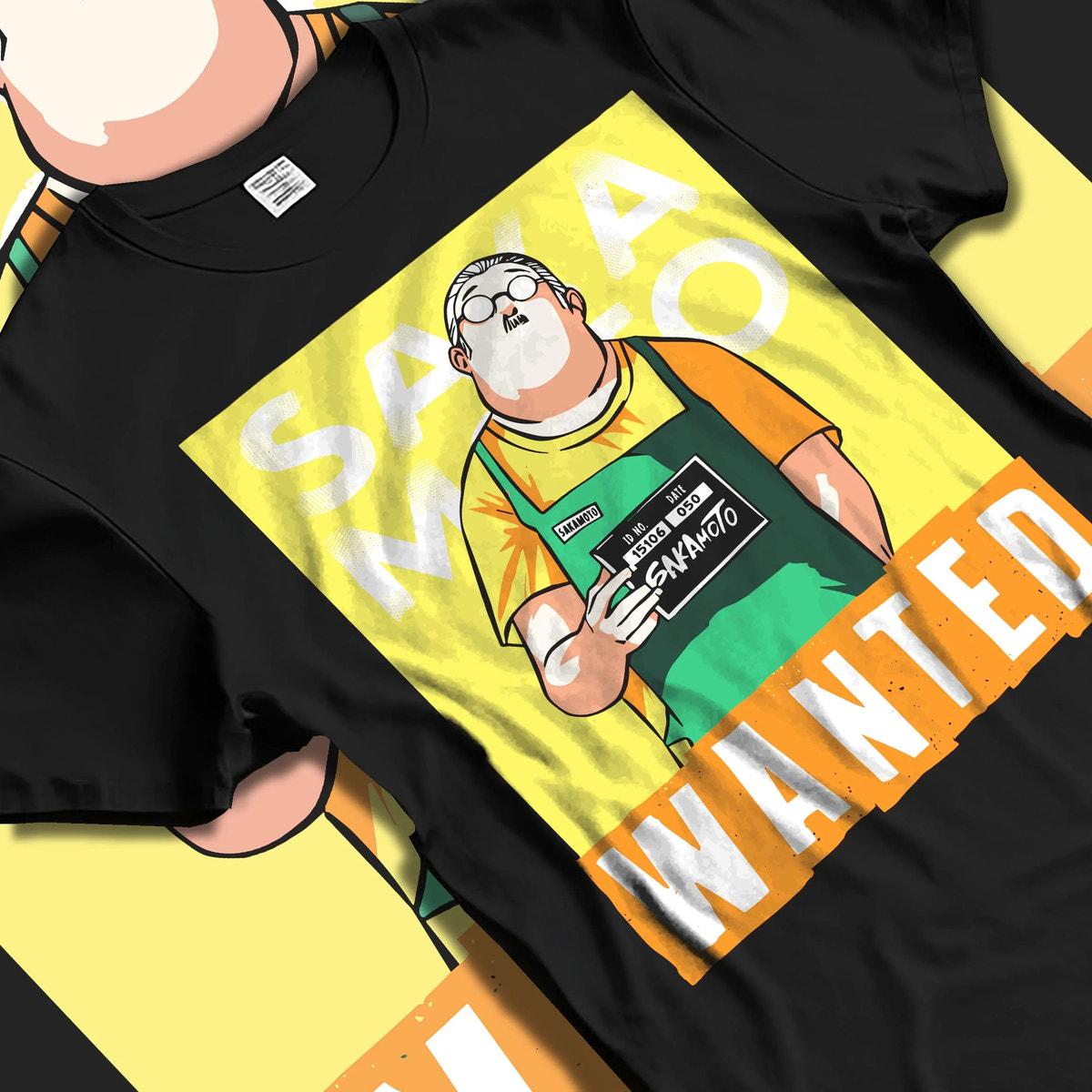 Black T-shirt laid flat with natural folds featuring Taro Sakamoto wanted poster Sakamoto Days artwork.