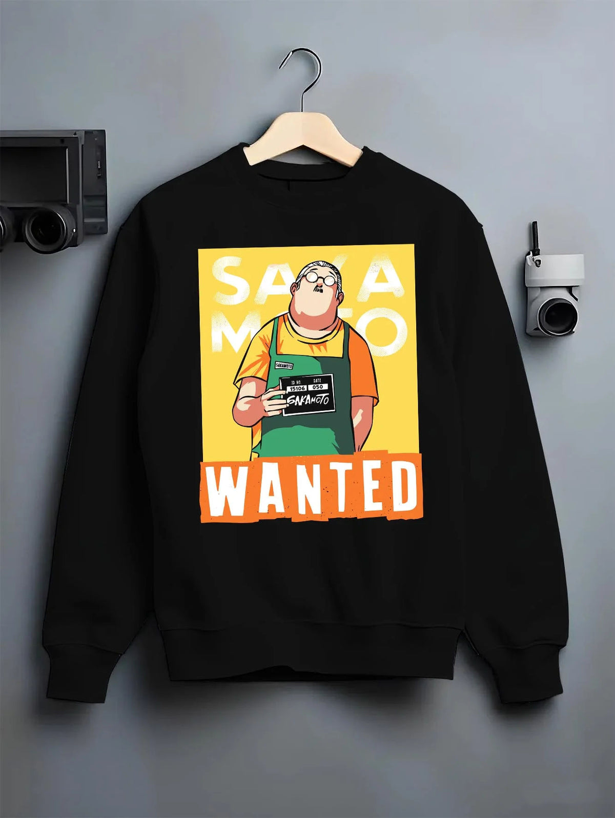 Black crewneck sweatshirt on hanger featuring Taro Sakamoto wanted poster Sakamoto Days artwork.