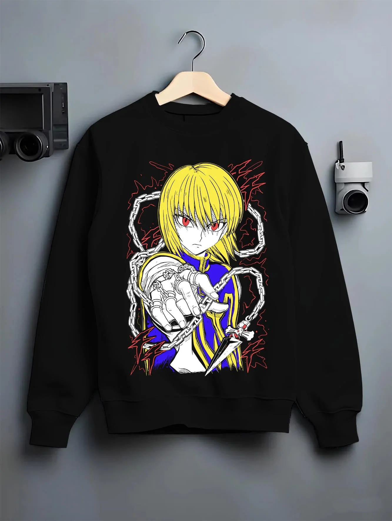 Black crewneck sweatshirt on hanger with Kurapika Hoodie Hunter x Hunter Chain Emperor graphic bold anime graphic.
