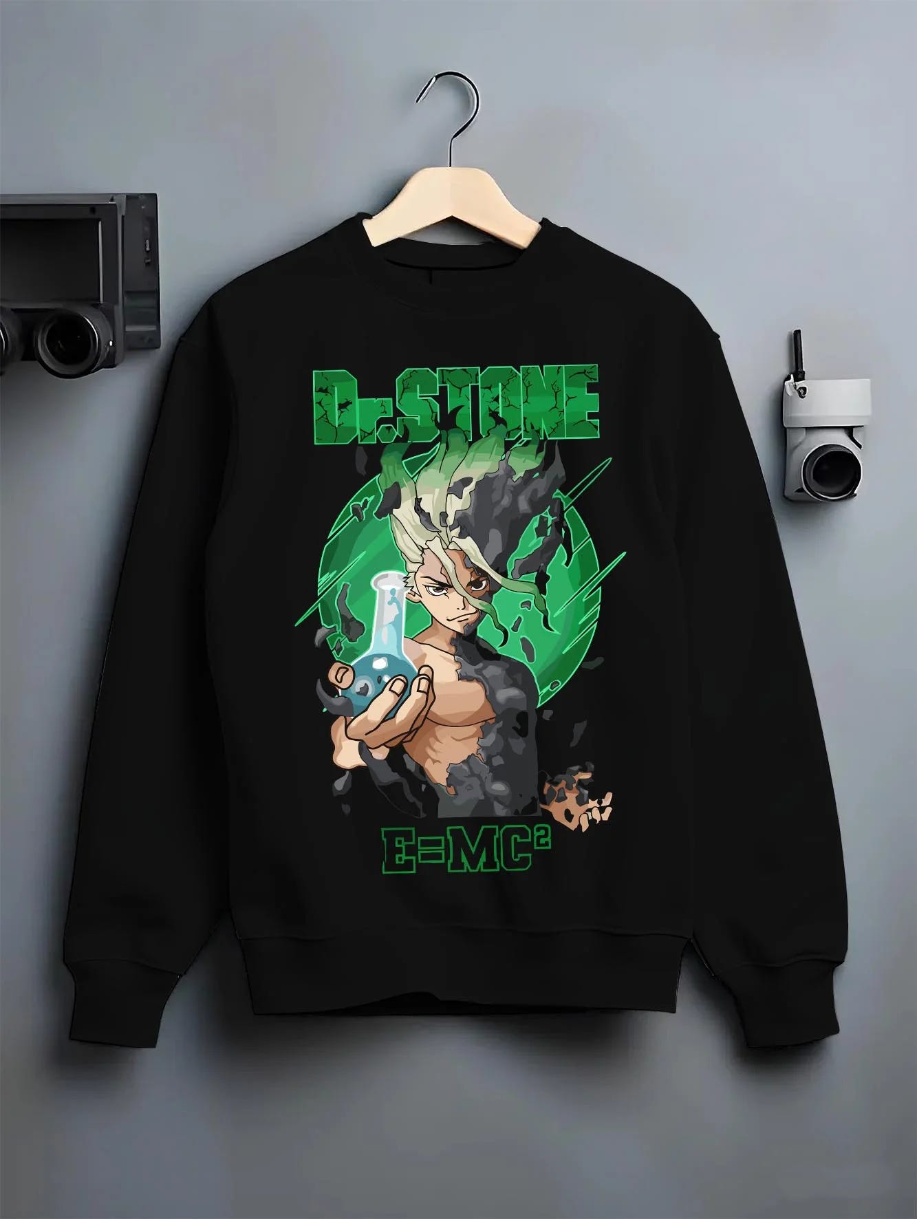 Black crewneck sweatshirt on hanger with Senku Hoodie Dr Stone Kingdom Science Genius Anime graphic streetwear graphic.