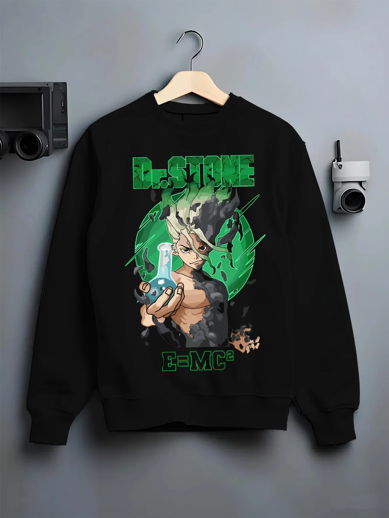 Black crewneck sweatshirt on hanger with Senku Hoodie Dr Stone Kingdom Science Genius Anime graphic streetwear graphic.