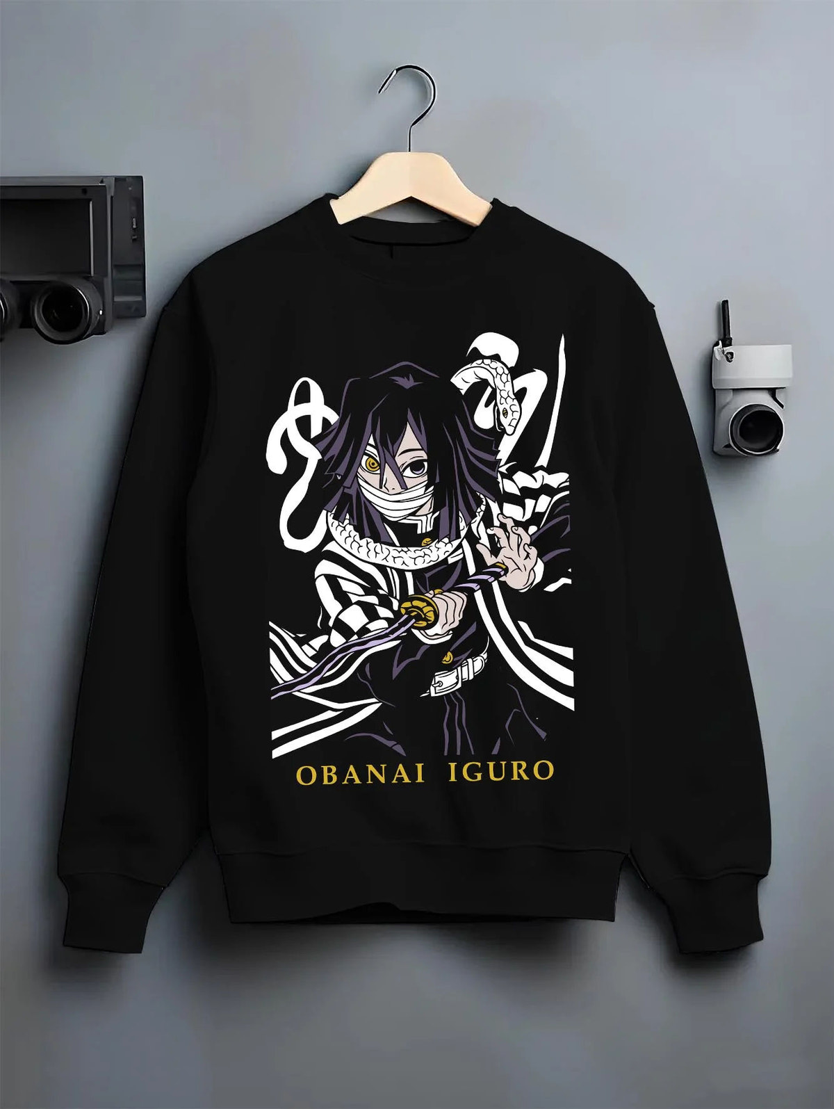 Black crewneck sweatshirt on hanger featuring Obanai Iguro Serpent Breathing snake Demon Slayer artwork.