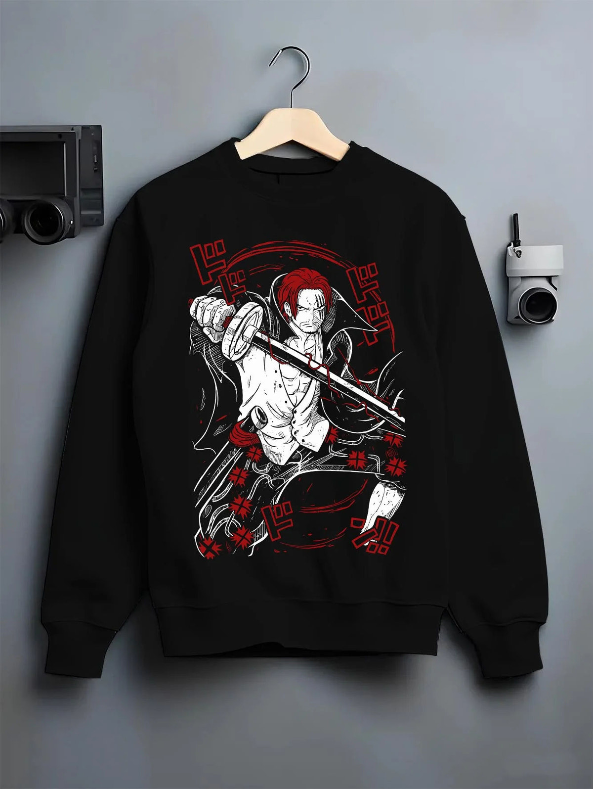 Black crewneck sweatshirt on hanger featuring Shanks Red Hair Emperor Haki One Piece artwork.