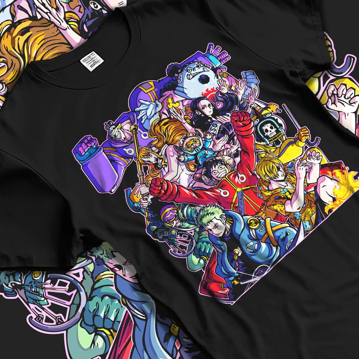 Black T-shirt laid flat with natural folds featuring Straw Hat Crew pirate team adventure One Piece artwork.