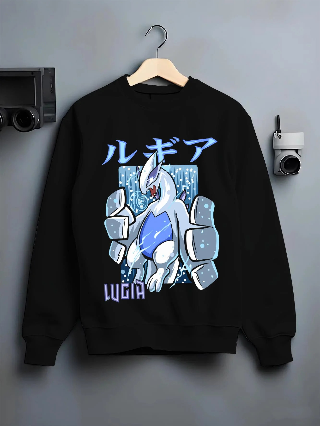 Black crewneck sweatshirt on hanger with Lugia Hoodie Pokémon Legendary Guardian Design graphic bold anime graphic.