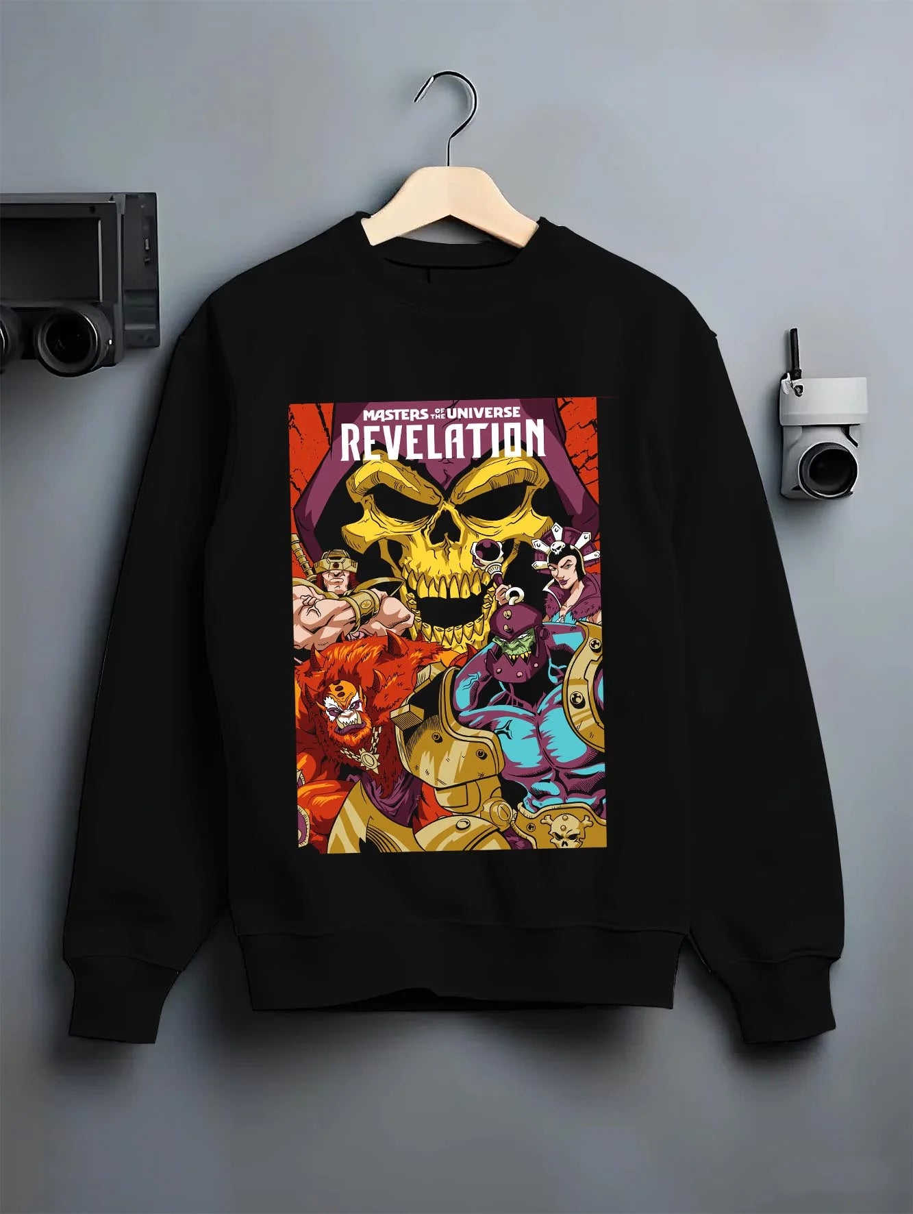 Black crewneck sweatshirt on hanger with Skeletor Hoodie Masters of the Universe Villain graphic bold anime graphic.