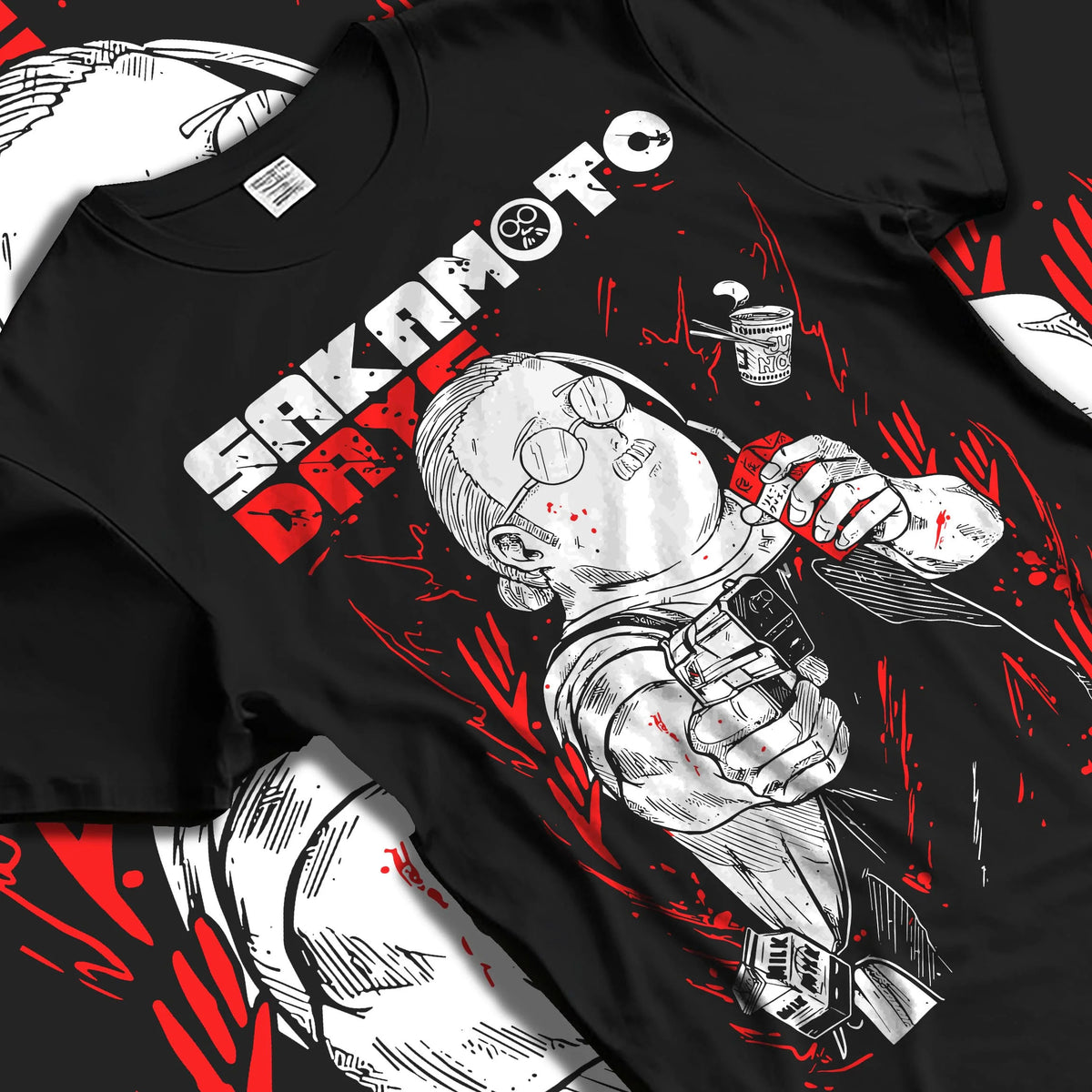 Black T-shirt laid flat with natural folds featuring Taro Sakamoto sketch hitman Sakamoto Days artwork.