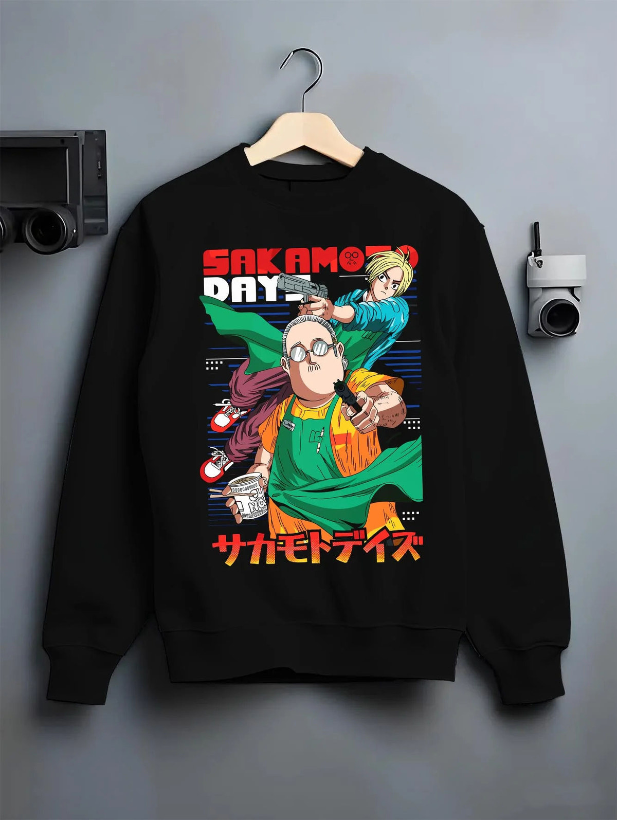 Black crewneck sweatshirt on hanger featuring Sakamoto Days assassin cast group artwork.