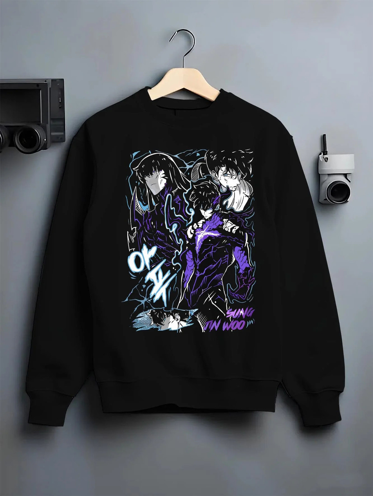 Black crewneck sweatshirt on hanger featuring Sung Jin-Woo shadow dragon battle Solo Leveling artwork.