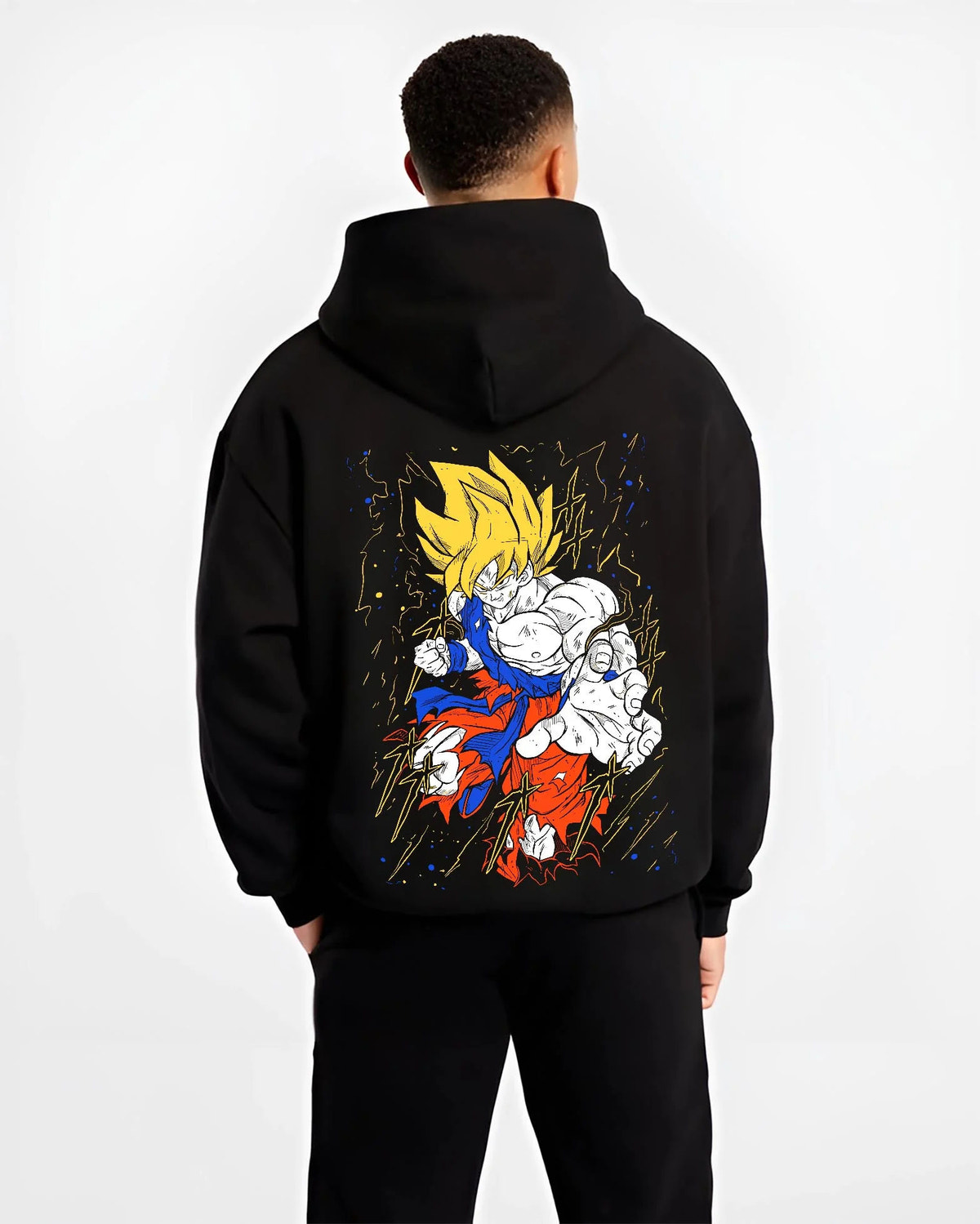 Black hoodie worn by male model from the back featuring Goku Super Saiyan battle power Dragon Ball Z artwork.