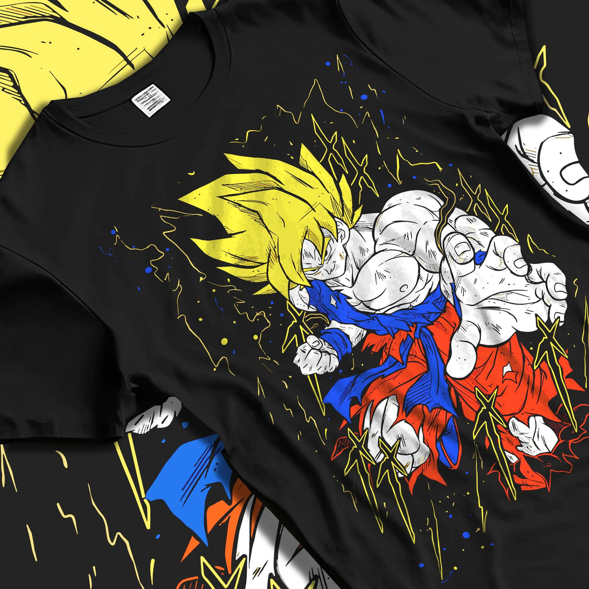 Black T-shirt laid flat with natural folds featuring Goku Super Saiyan battle power Dragon Ball Z artwork.