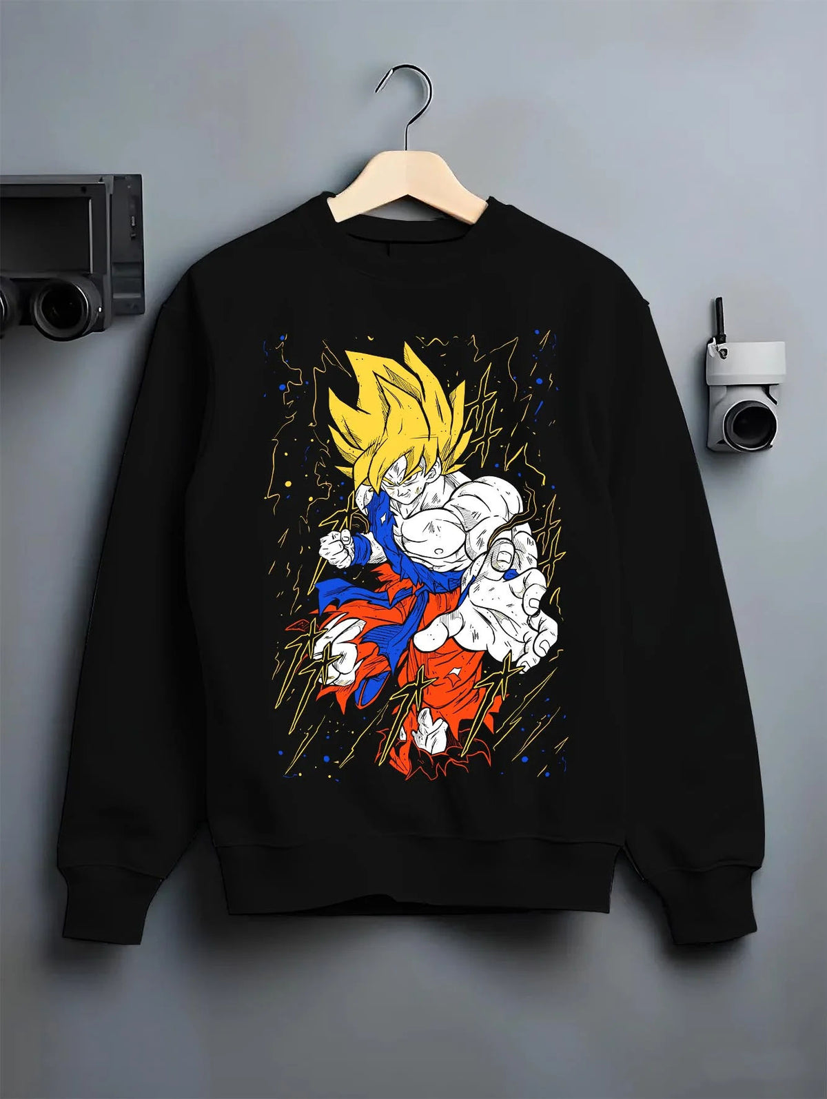 Black crewneck sweatshirt on hanger featuring Goku Super Saiyan battle power Dragon Ball Z artwork.