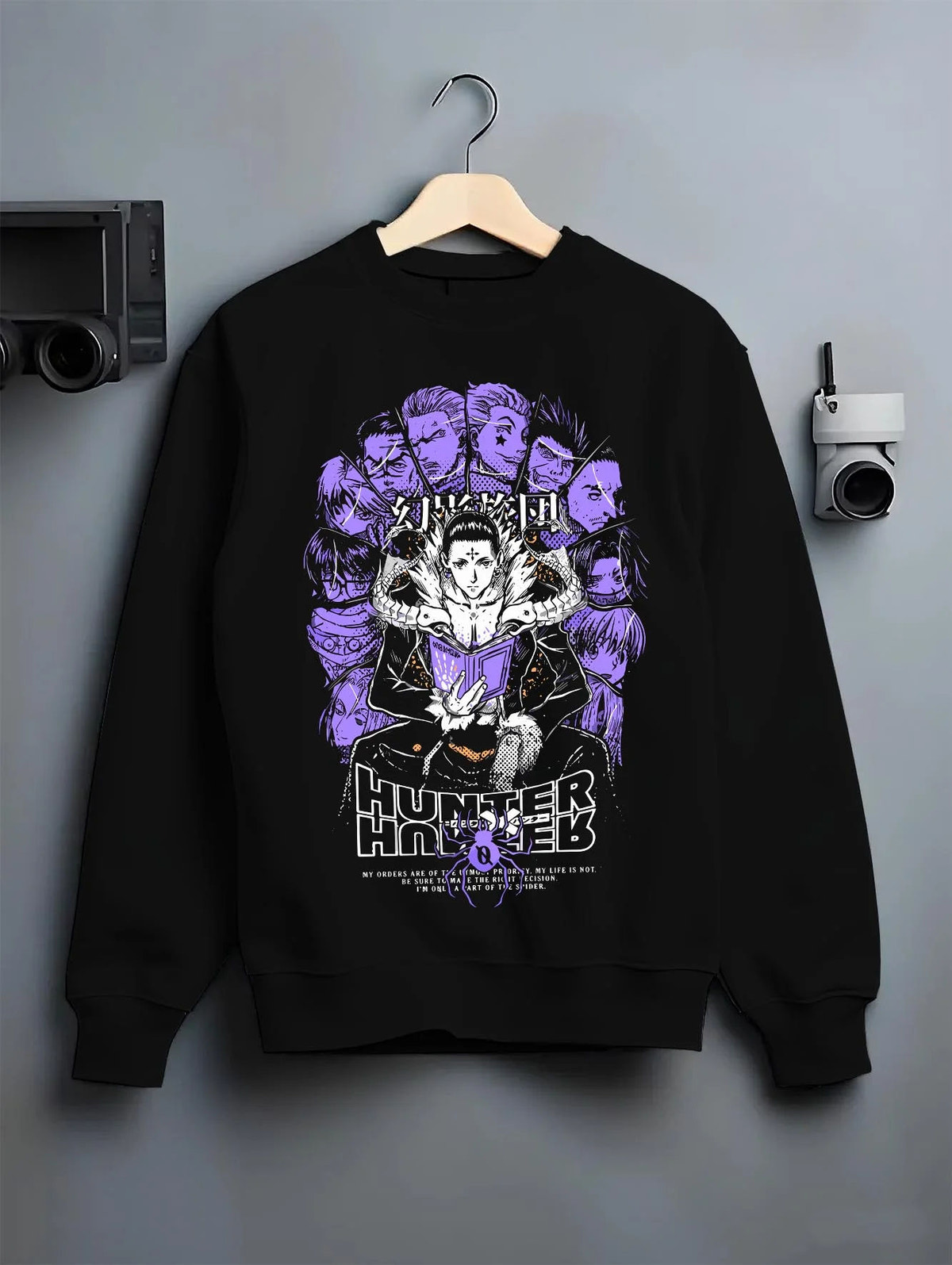 Black crewneck sweatshirt on hanger featuring Chrollo Lucilfer Phantom Troupe Hunter x Hunter artwork.