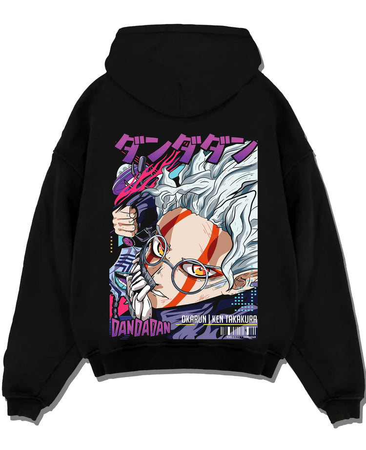 Black pullover hoodie laid flat with Ken Takakura Hoodie Dandadan Dynamic Fight Scene graphic streetwear graphic.