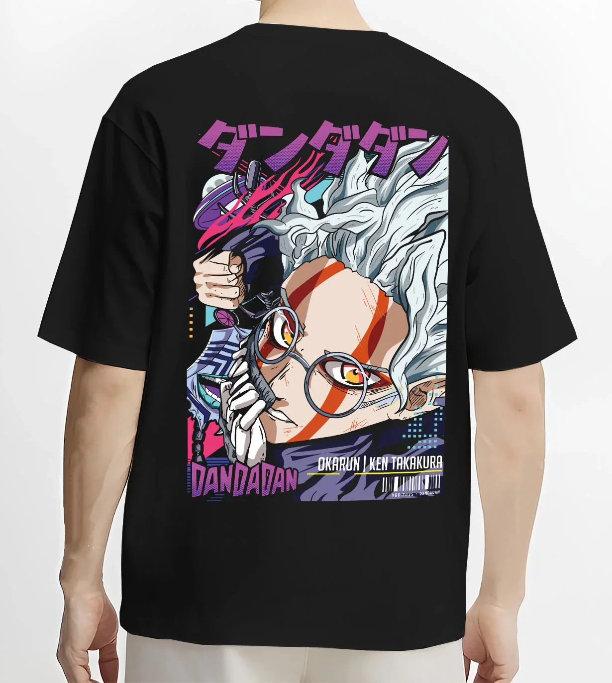 Black T-shirt worn by male model, back view with Ken Takakura Hoodie Dandadan Dynamic Fight Scene graphic bold anime graphic.