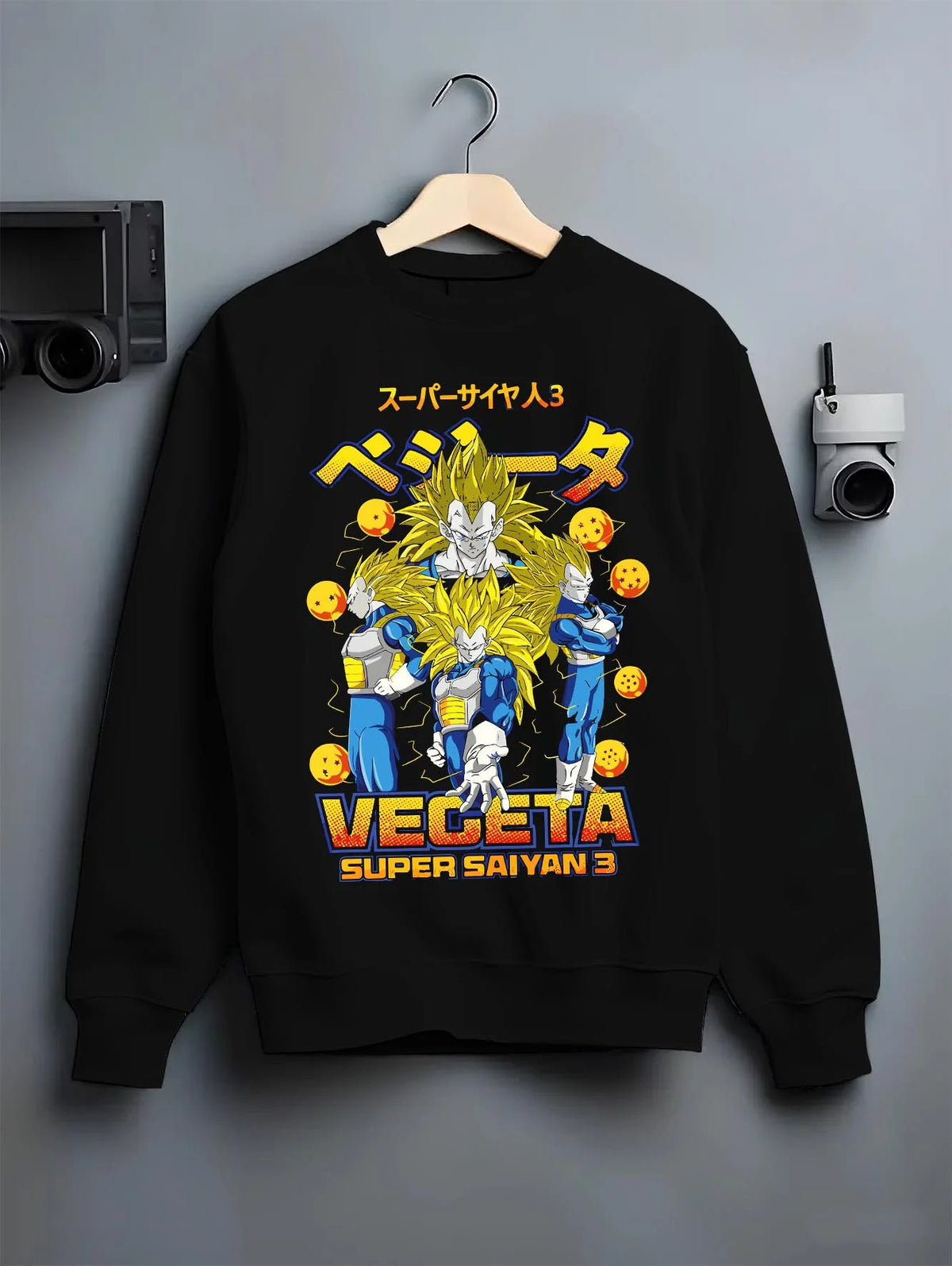 Black crewneck sweatshirt on hanger featuring Vegeta Super Saiyan 3 golden power Dragon Ball artwork.