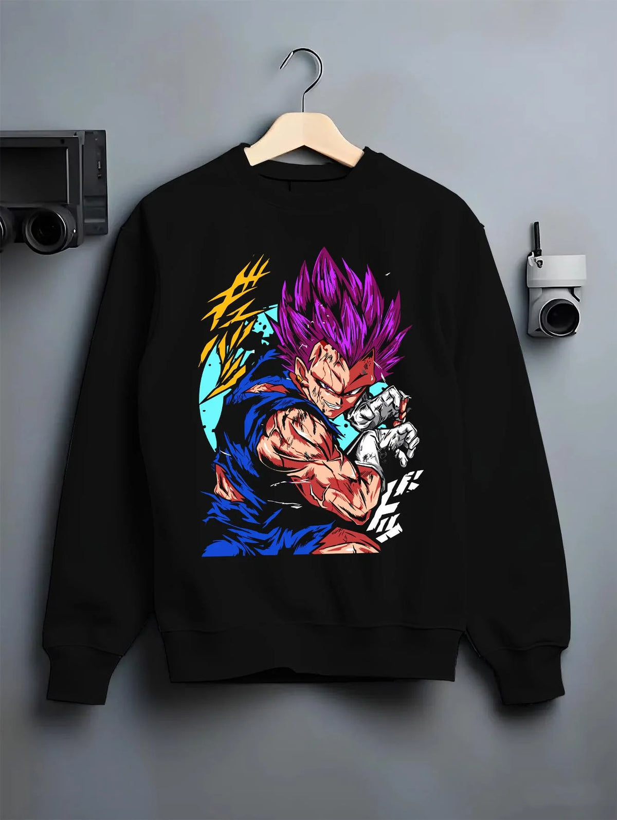 Black crewneck sweatshirt on hanger featuring Vegeta Ultra Ego purple destruction power Dragon Ball Super artwork.