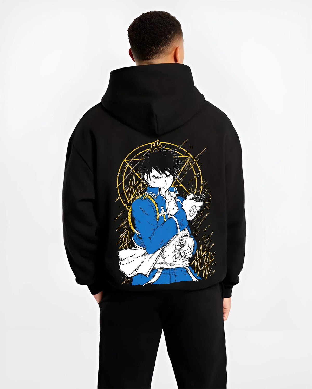 Black hoodie worn by male model from the back featuring Roy Mustang Flame Alchemist Fullmetal Alchemist artwork.