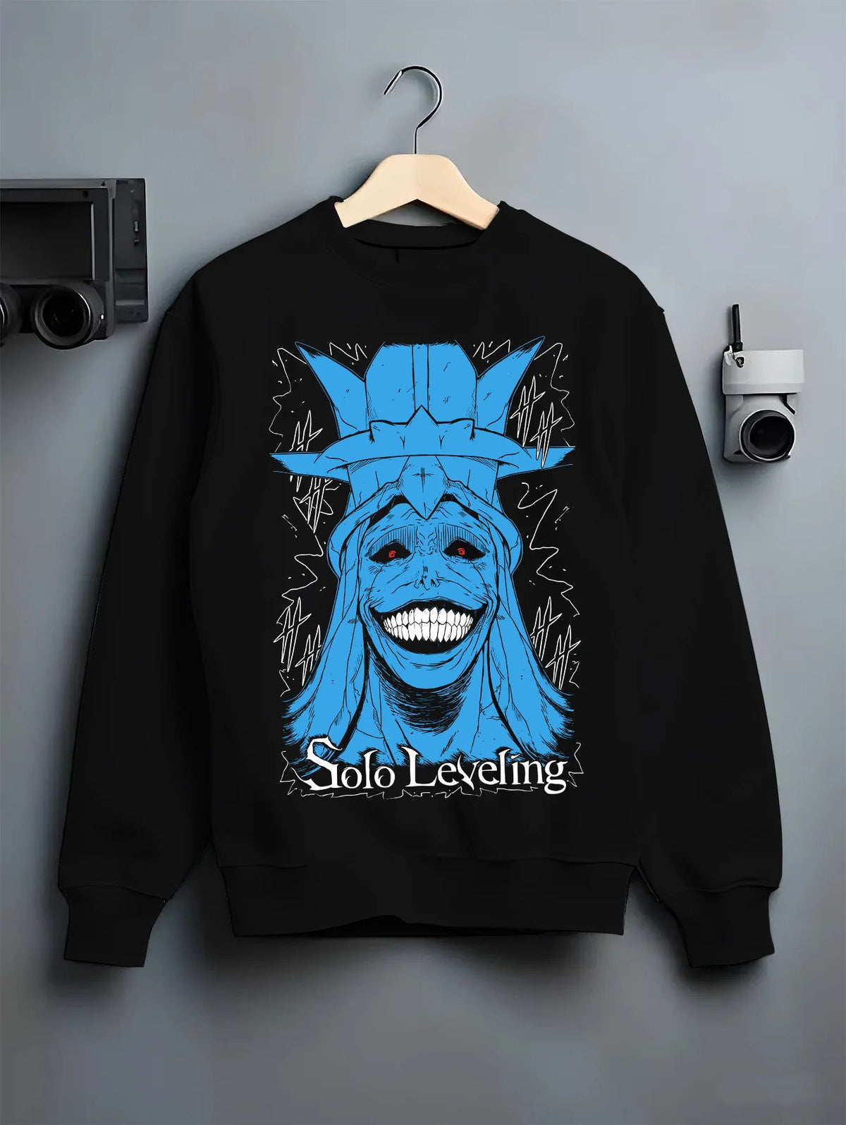 Black crewneck sweatshirt on hanger showing Statue of God from Solo Leveling: blue grinning face