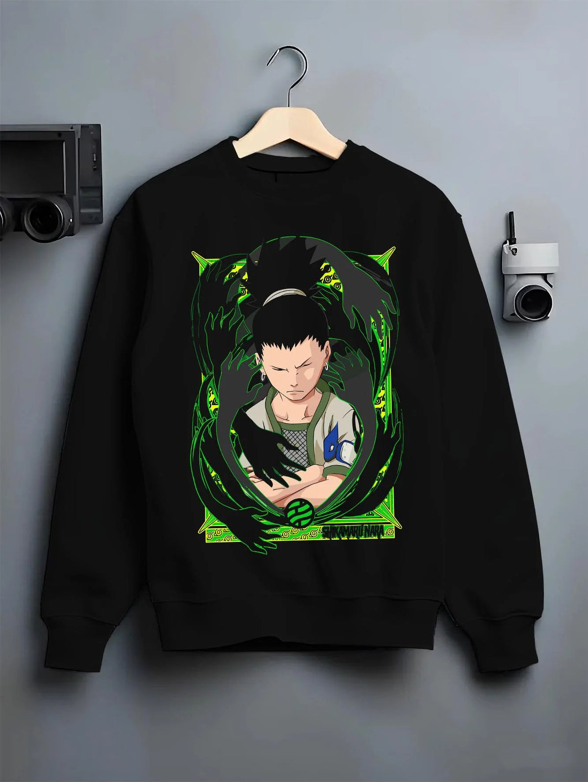 Black crewneck sweatshirt on hanger featuring Shikamaru Nara Shadow Possession Jutsu Naruto artwork.