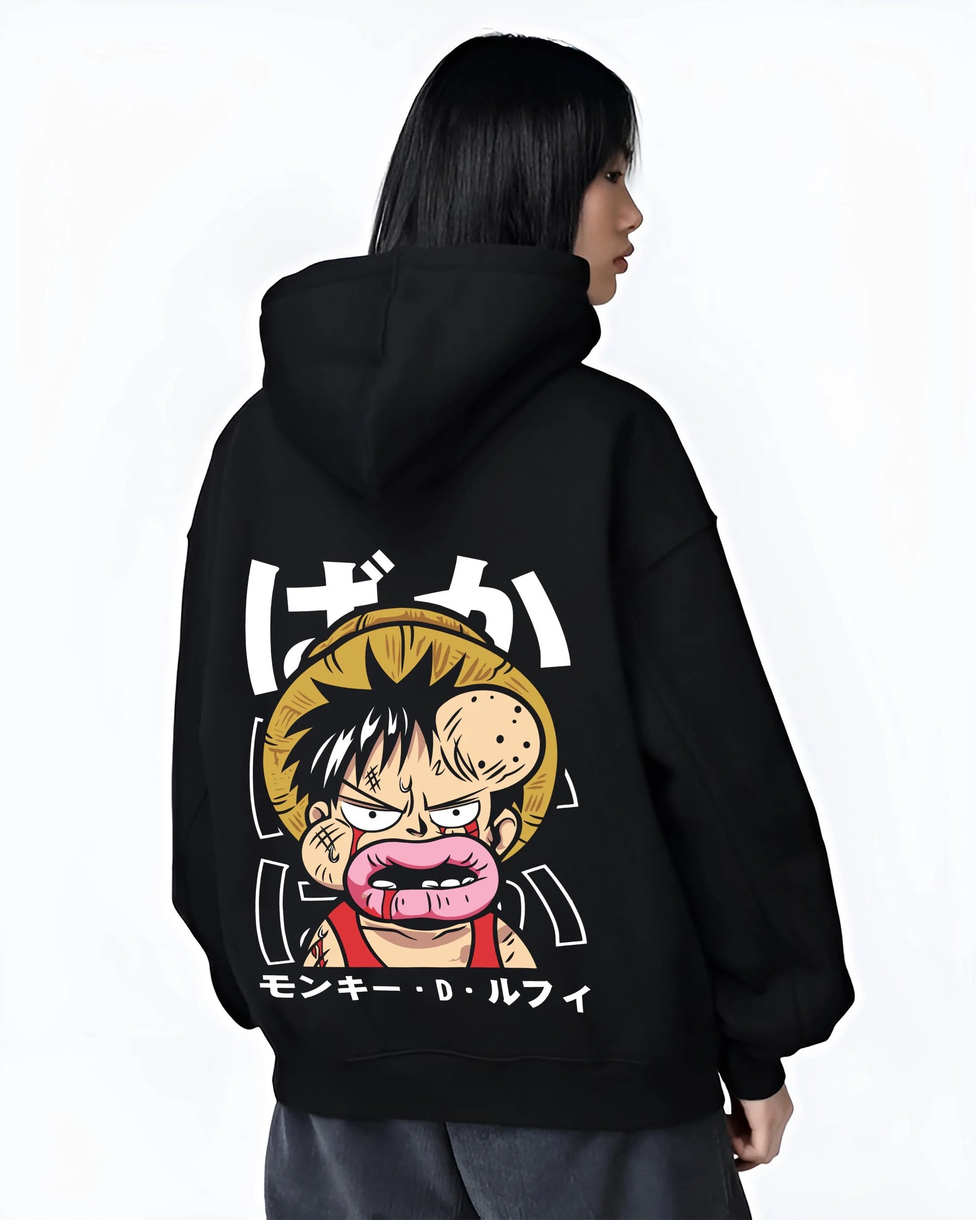 Black hoodie worn by female model, back view with Monkey D Luffy Hoodie One Piece Funny Face graphic premium wear.