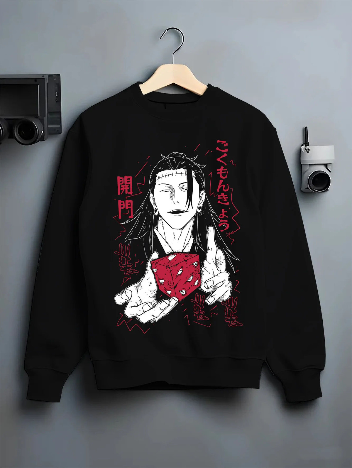 Black crewneck sweatshirt on hanger showing Suguru Geto from Jujutsu Kaisen: black-haired sorcerer with red die