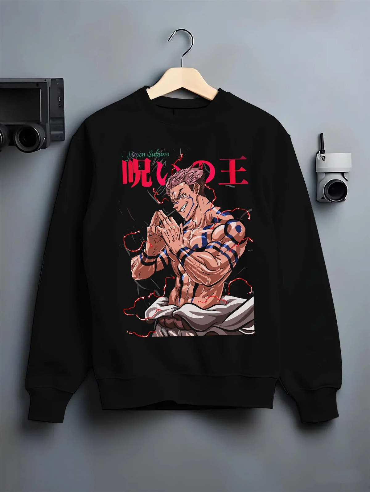 Black crewneck sweatshirt on hanger featuring Ryomen Sukuna Heian form Jujutsu Kaisen artwork.