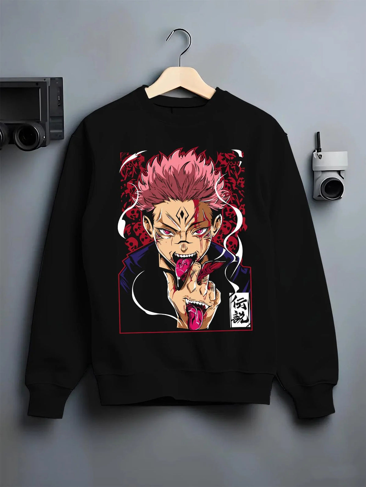 Black crewneck sweatshirt on hanger featuring Sukuna Yuji possession Jujutsu Kaisen artwork.