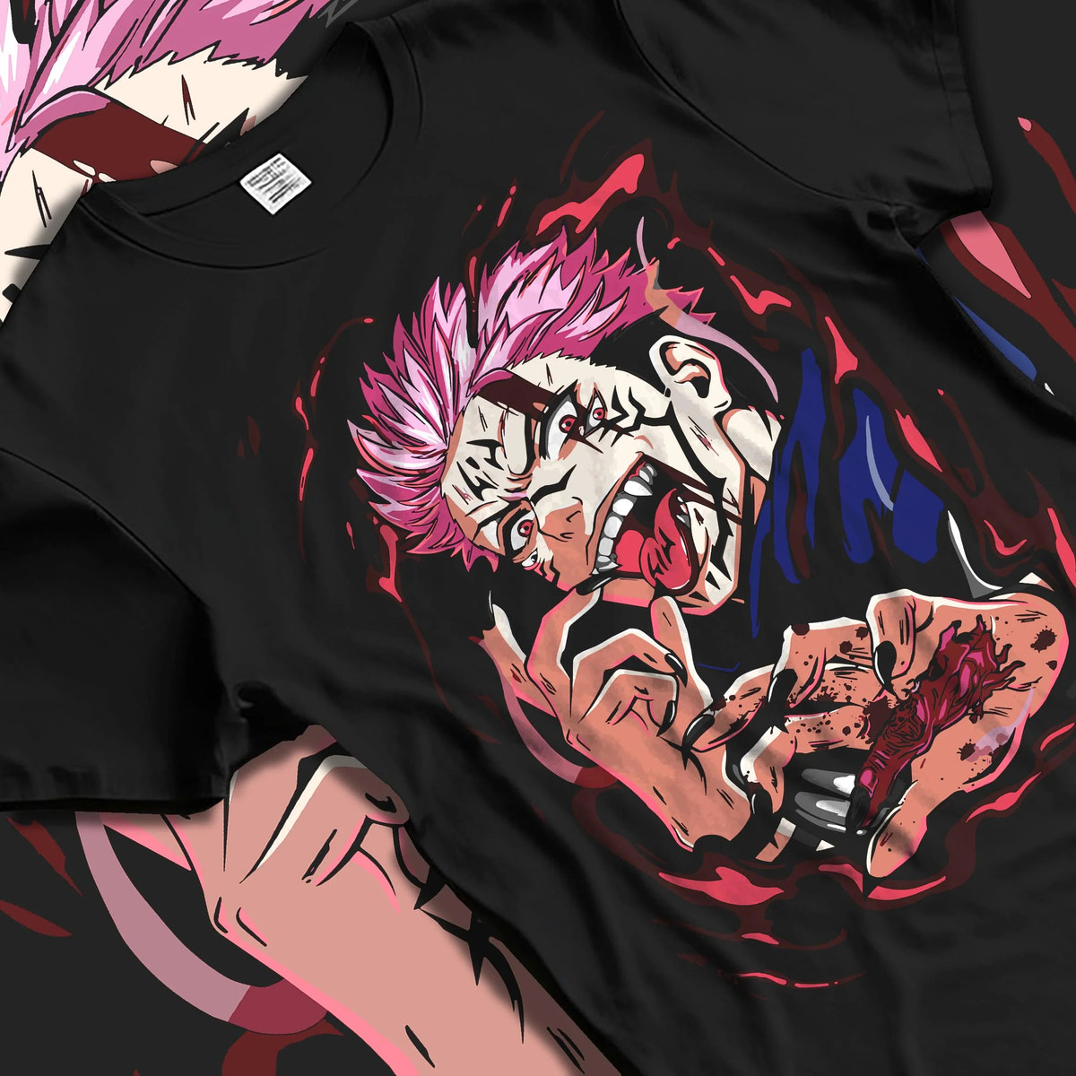 Black T-shirt laid flat with natural folds featuring Ryomen Sukuna red cursed energy Jujutsu Kaisen artwork.