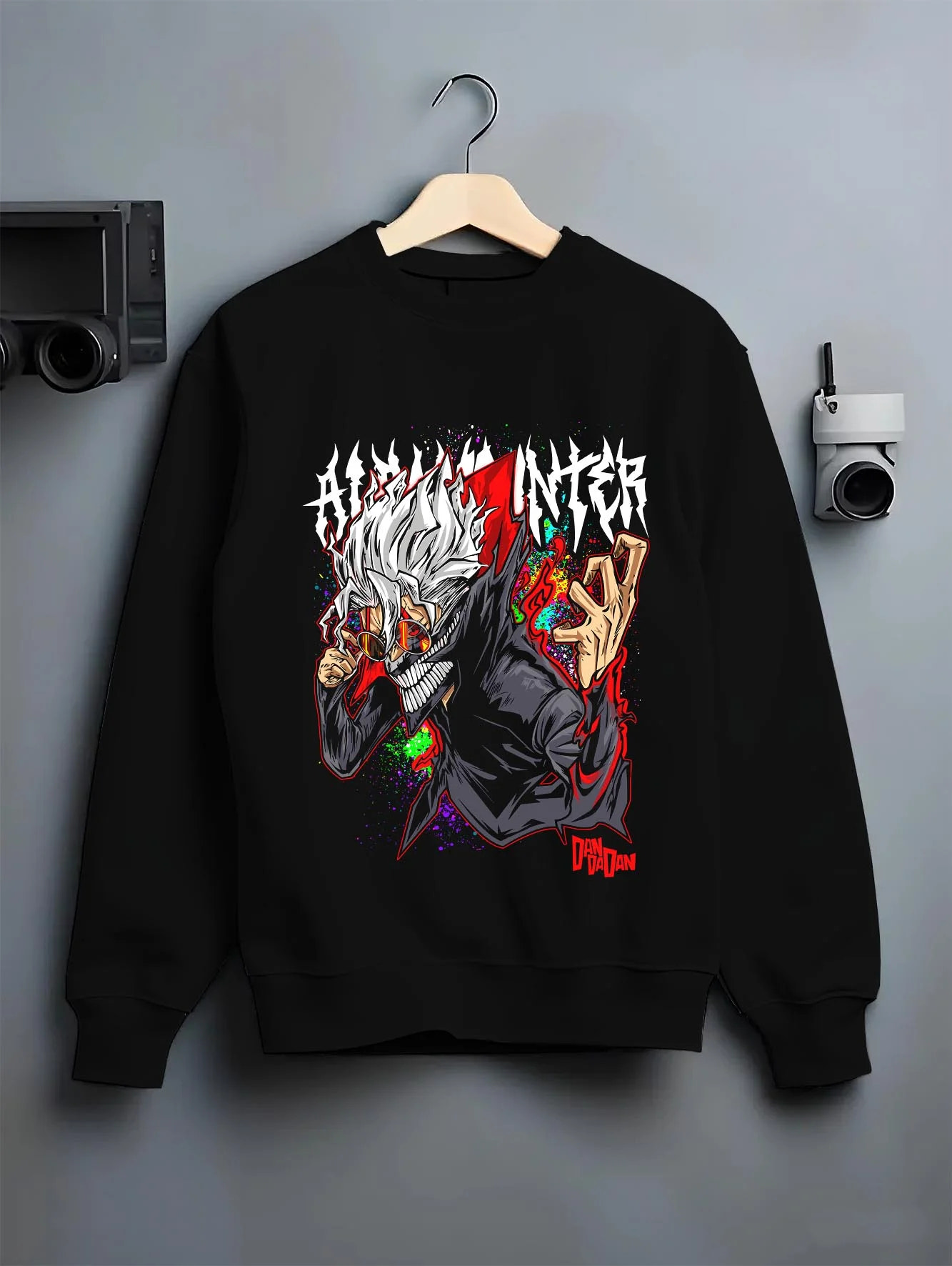 Black crewneck sweatshirt on hanger with Evil Spirit Hoodie Dandadan Horror Monster Scene graphic bold anime graphic.