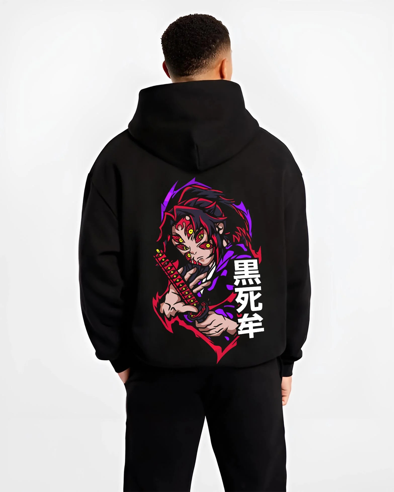 Black hoodie worn by male model, back view with Kokushibo Hoodie Demon Slayer Moon Breathing Form graphic streetwear graphic.