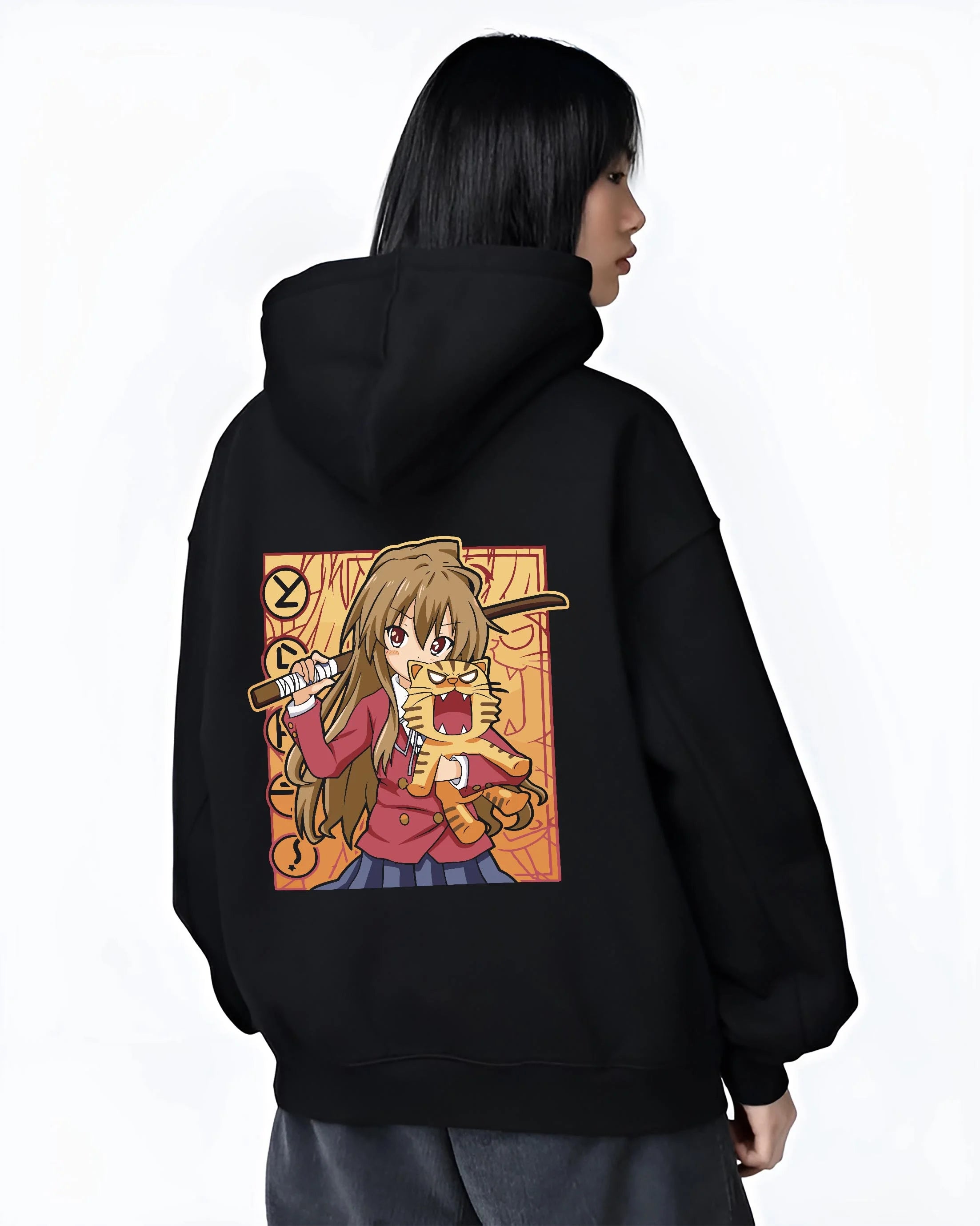 Black hoodie worn by female model, back view with Taiga Hoodie Toradora Anime Tiger Romantic Comedy graphic bold anime graphic.