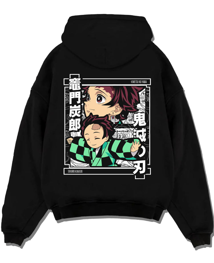 Black hoodie laid flat featuring Tanjiro Kamado chibi family Demon Slayer artwork.