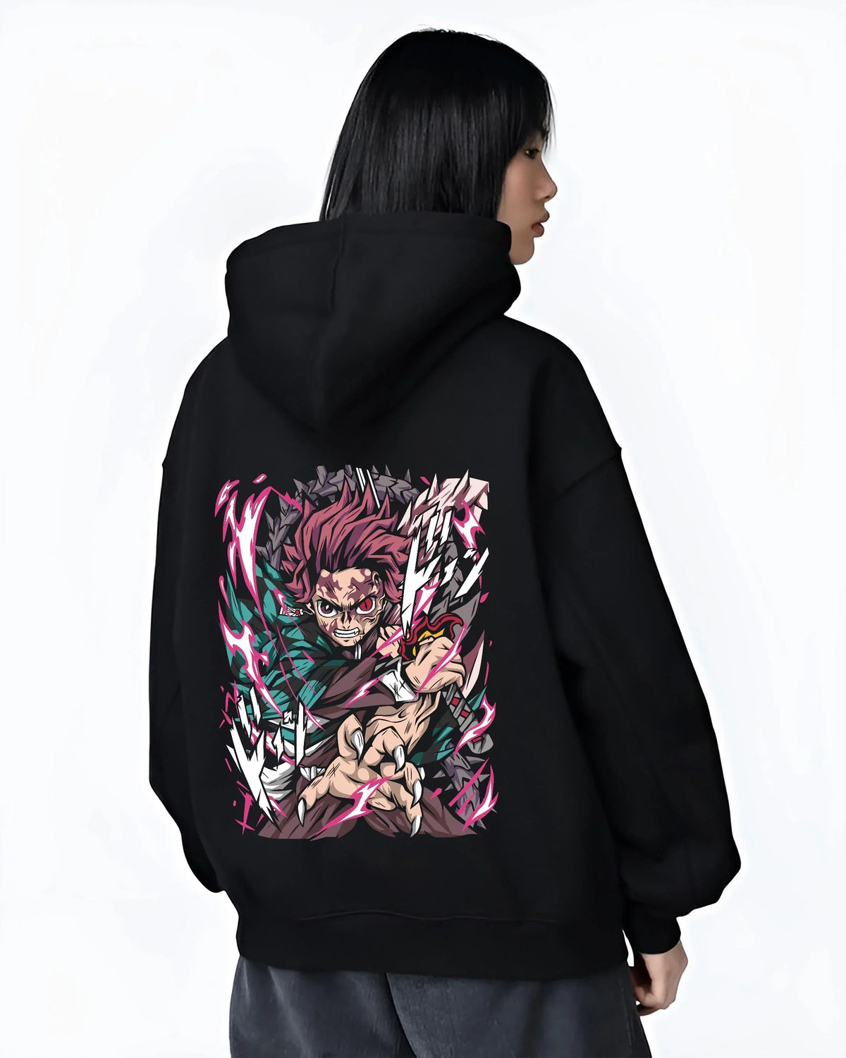 Black hoodie worn by female model, back view with Tanjiro Hoodie Demon Slayer Hero Water Breathing graphic streetwear graphic.